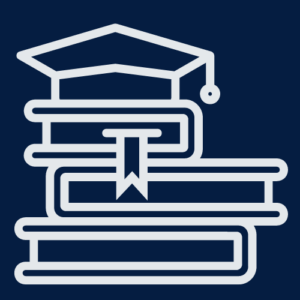 stack of books with a graduation hat on top